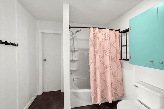 bathroom with shower / bath combo with shower curtain and toilet