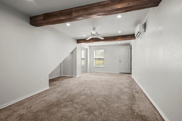 interior space with beamed ceiling, carpet floors, a wall unit AC, and ceiling fan