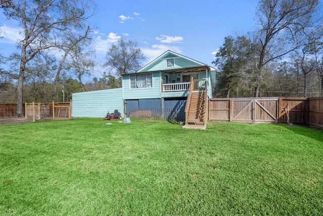 rear view of house with a lawn