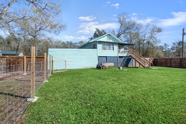 back of property featuring a lawn