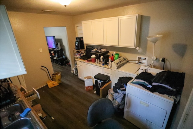 laundry room with dark wood-type flooring and independent washer and dryer