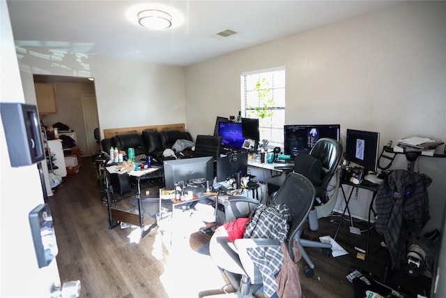 home office with hardwood / wood-style flooring