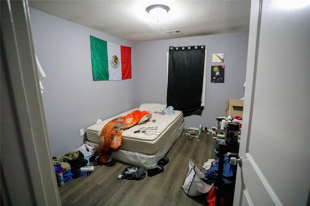 bedroom featuring wood-type flooring