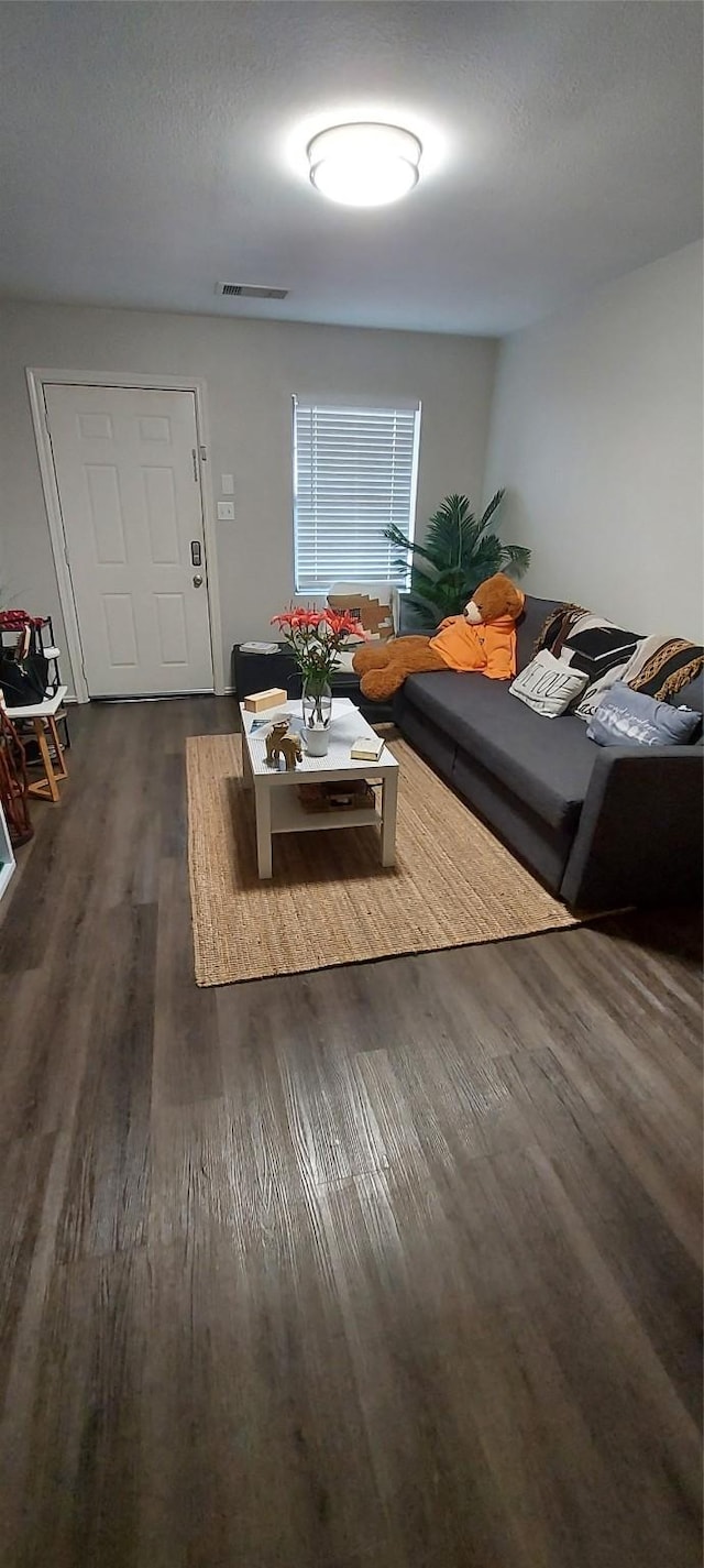 living room with dark hardwood / wood-style floors