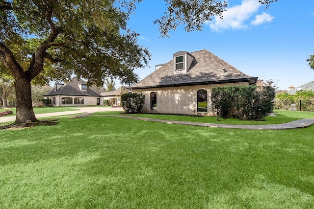 view of side of property with a yard