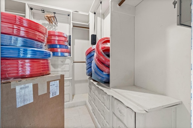 spacious closet featuring light tile patterned floors