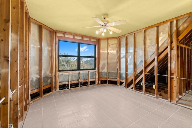 interior space featuring ceiling fan and light tile patterned flooring