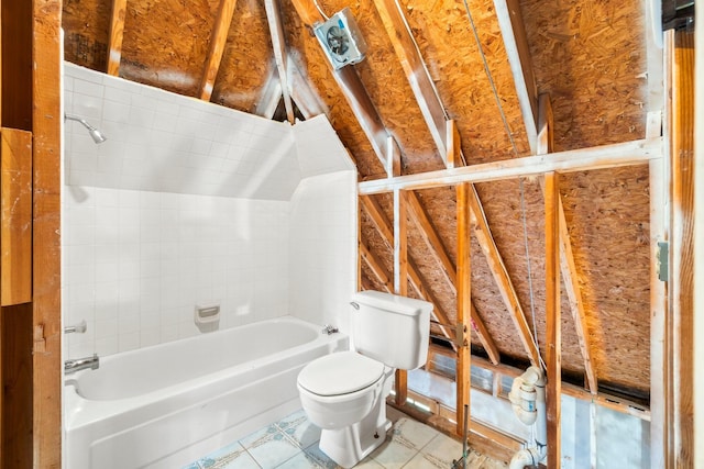 bathroom featuring tile patterned flooring, toilet, and shower / bathtub combination