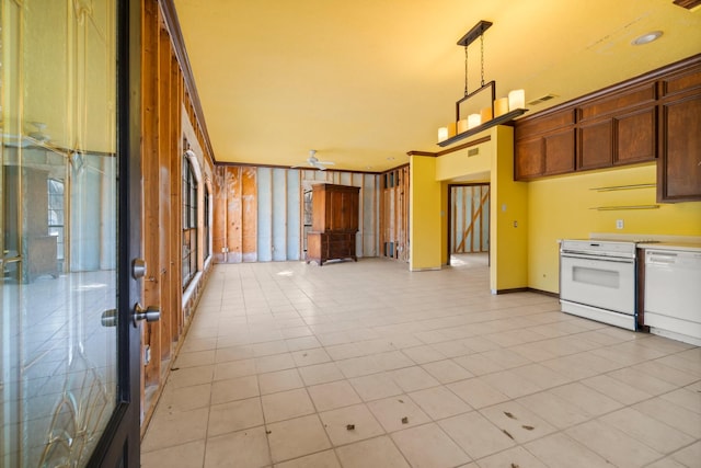 kitchen with dishwasher, stove, hanging light fixtures, crown molding, and light tile patterned flooring