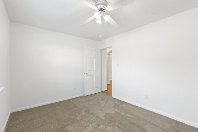 empty room with carpet and ceiling fan