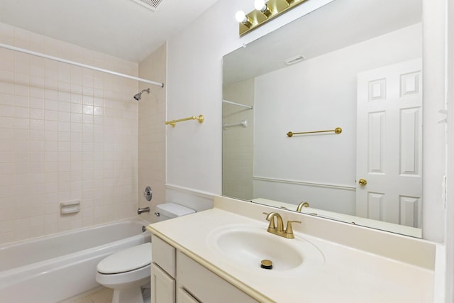 full bathroom with vanity, toilet, and tiled shower / bath