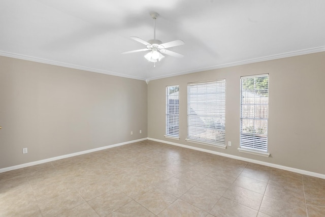 tiled empty room featuring ceiling fan and ornamental molding