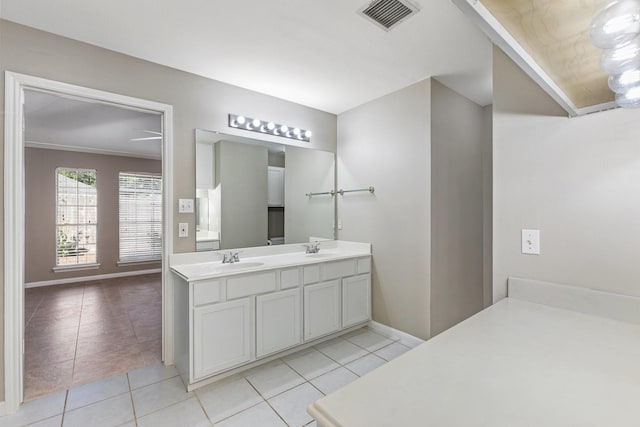 bathroom with vanity, tile patterned floors, and ornamental molding