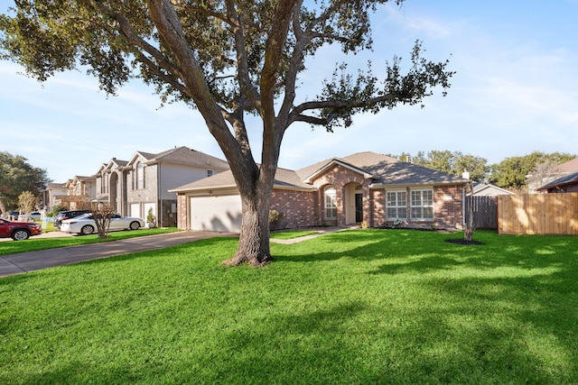 view of front of house with a front lawn and a garage