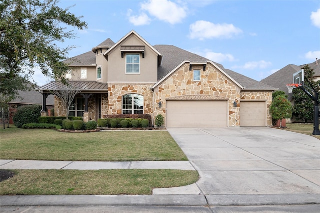 view of front facade with a front yard and a garage