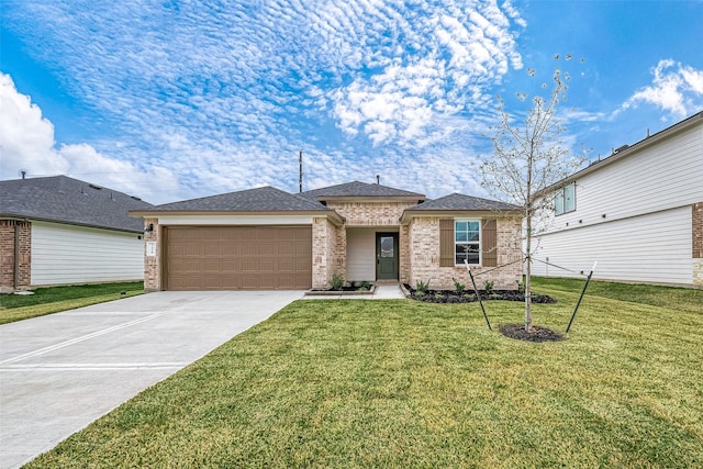 view of front of house featuring a front yard and a garage