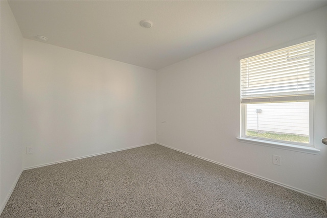 unfurnished room featuring carpet