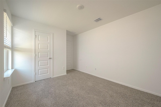 unfurnished room with carpet floors