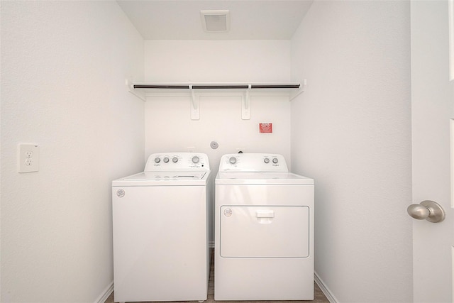 laundry area with washer and clothes dryer