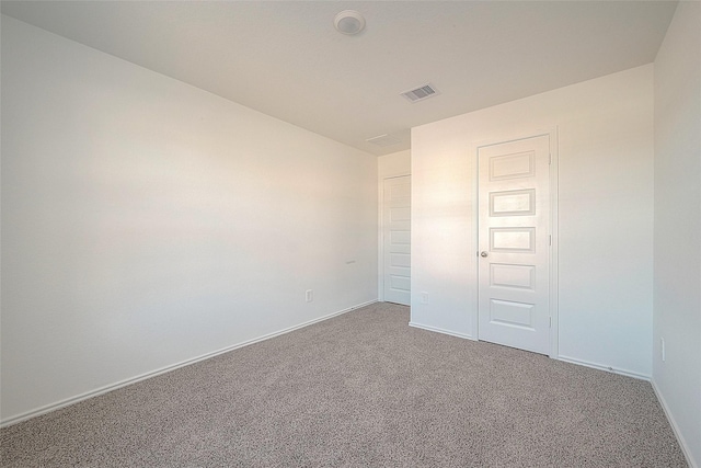 unfurnished bedroom featuring carpet floors and a closet