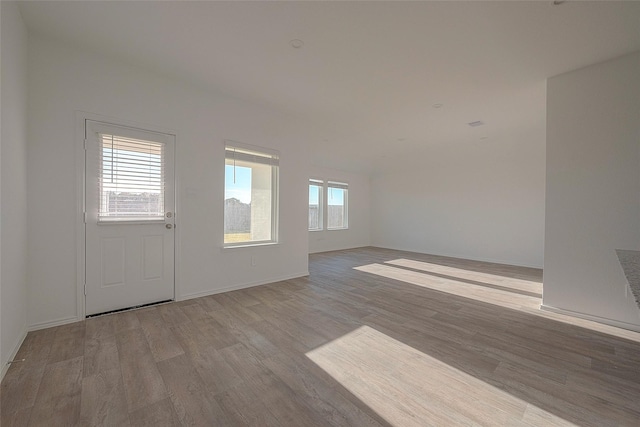 unfurnished room featuring light hardwood / wood-style flooring