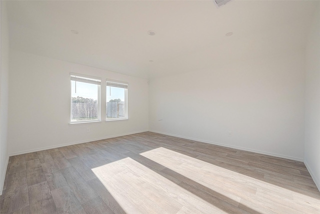 empty room with light wood-type flooring