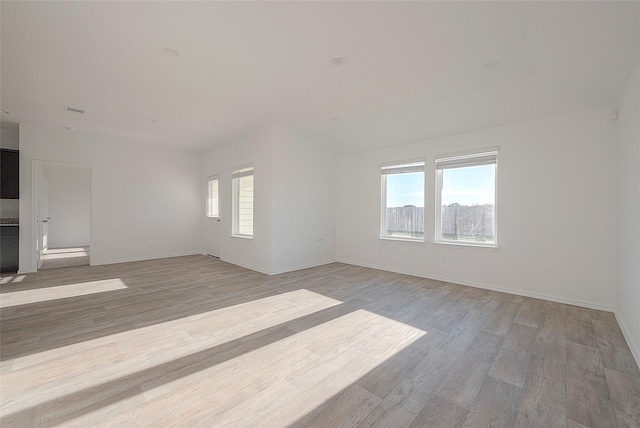 unfurnished room featuring light hardwood / wood-style floors