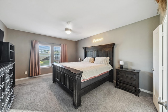 bedroom with ceiling fan and carpet