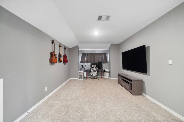 unfurnished living room with light colored carpet and vaulted ceiling