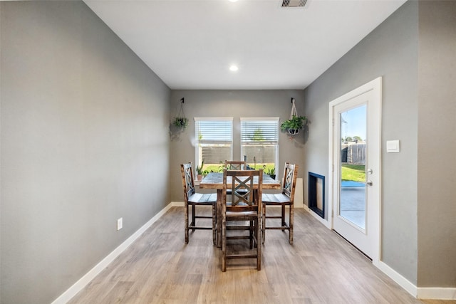 dining space featuring light hardwood / wood-style floors and plenty of natural light