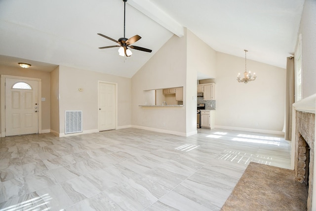 unfurnished living room with ceiling fan with notable chandelier, beam ceiling, a stone fireplace, and high vaulted ceiling