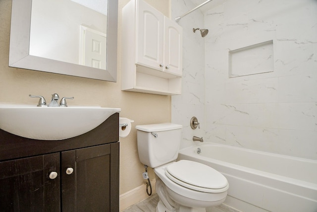 full bathroom with vanity, toilet, and tiled shower / bath