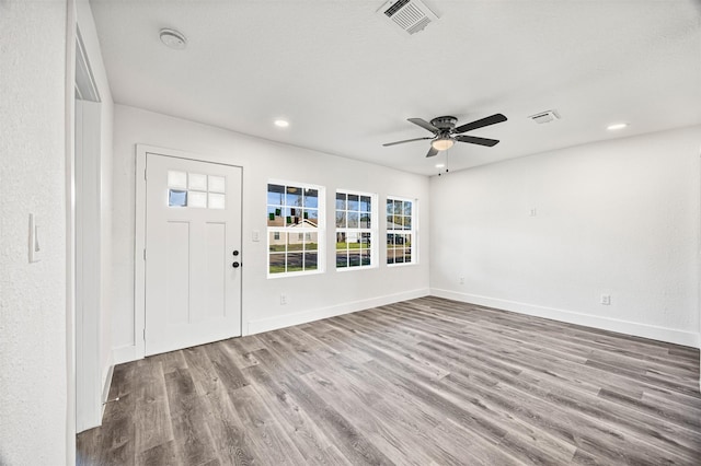 foyer featuring ceiling fan and light wood-type flooring