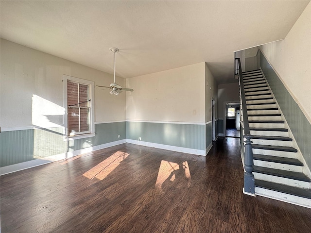 unfurnished dining area with ceiling fan and dark hardwood / wood-style flooring