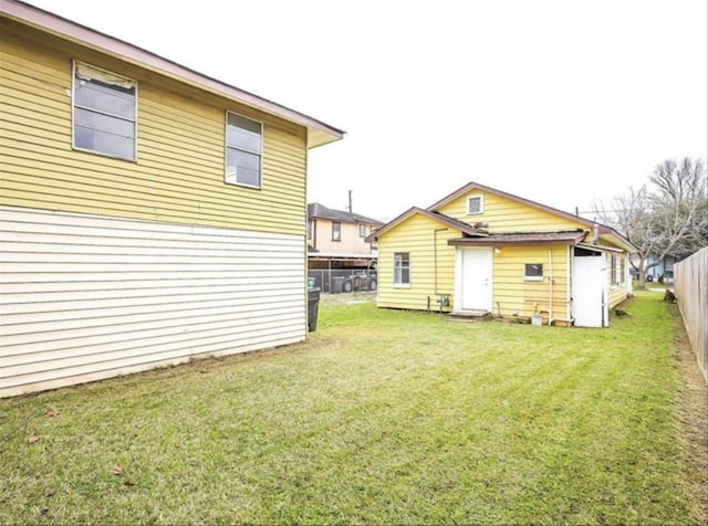 back of house with a yard