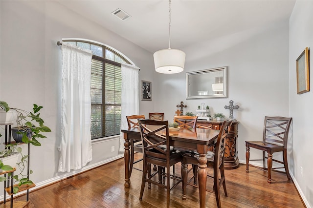 dining room featuring dark wood-type flooring