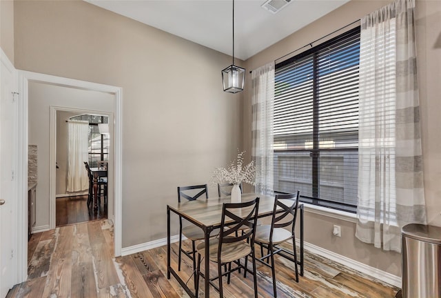 dining room with hardwood / wood-style flooring