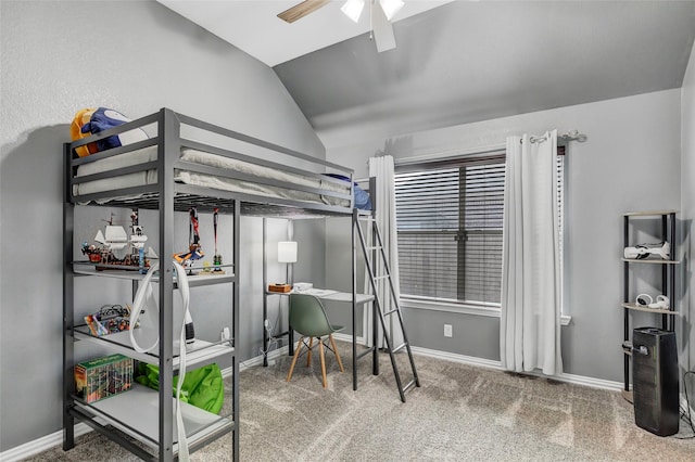 carpeted bedroom with ceiling fan and lofted ceiling