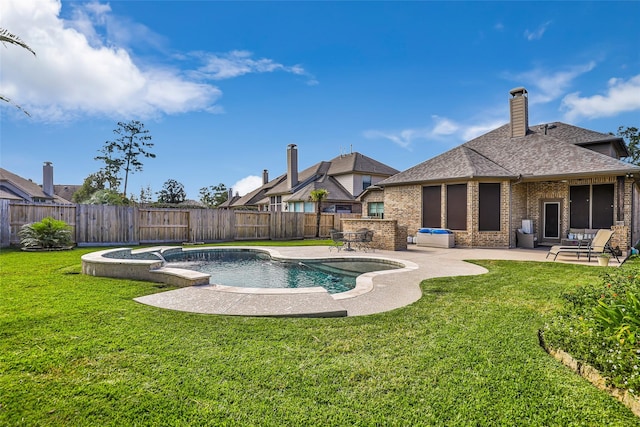 view of pool with a yard and a patio area