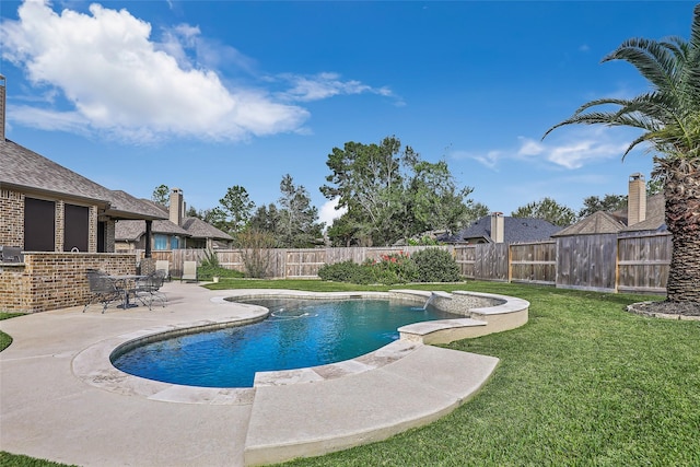 view of swimming pool featuring a lawn, a patio, and exterior bar