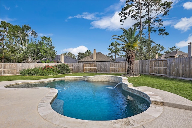 view of pool featuring pool water feature and a yard