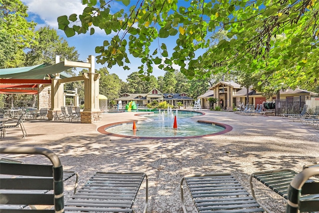 view of swimming pool featuring a patio area