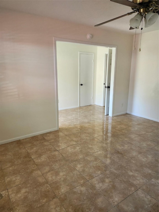 empty room featuring ceiling fan