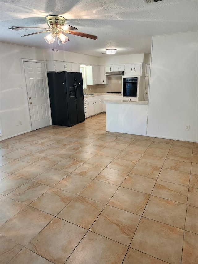 kitchen with black appliances, kitchen peninsula, ceiling fan, a textured ceiling, and white cabinetry