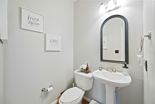 bathroom featuring toilet