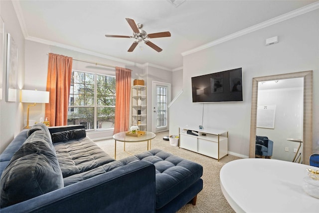 living room featuring ceiling fan, carpet flooring, and crown molding