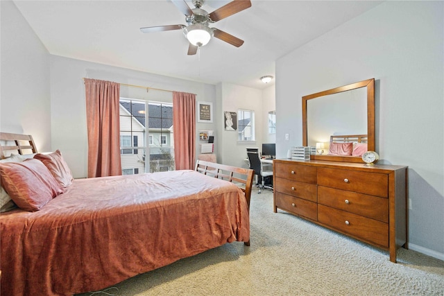 bedroom featuring ceiling fan and light carpet