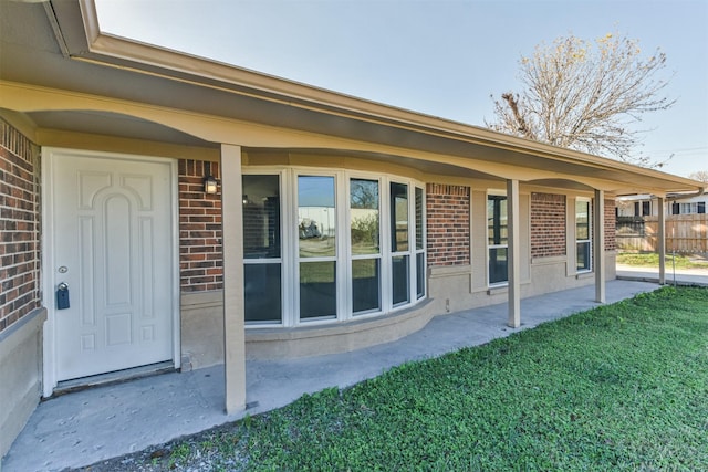 entrance to property with a yard