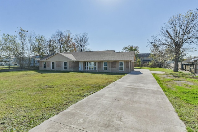 ranch-style home with a front yard