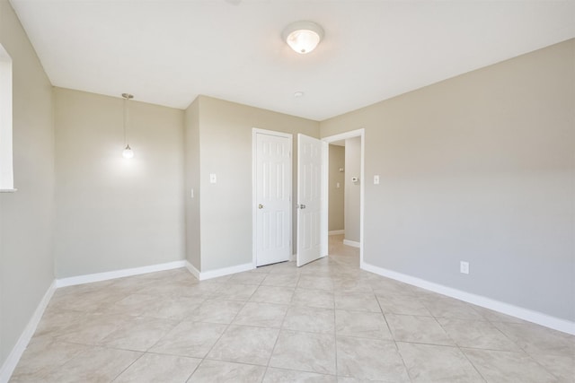 empty room with light tile patterned floors